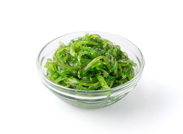 Green Chuka Seaweed Salad Isolated on White Background. Wakame Sea Kelp Salat, Chukka Sea Weed, Healthy Algae Food