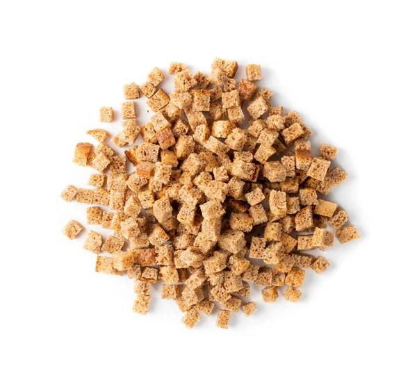 Pile of homemade rye bread croutons isolated on white background top view. Crispy bread cubes, dry rye crumbs, rusks, crouoton or brown roasted crackers cube heap — Stock Image Pile Homemade Rye Bread Croutons Isolated White Background Top View Stock Picture