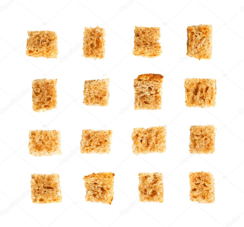 Set of homemade rye bread croutons isolated on white background top view. Crispy bread cubes collection, dry rye crumbs, rusks, crouoton or brown roasted crackers cube pattern