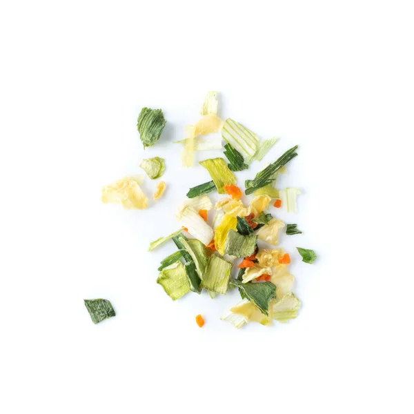 Dried chopped vegetables mix with carrots, onion and parsnip isolated on white background top view. Heap of dry carrot flakes, dehydrated various vegetable pieces collection