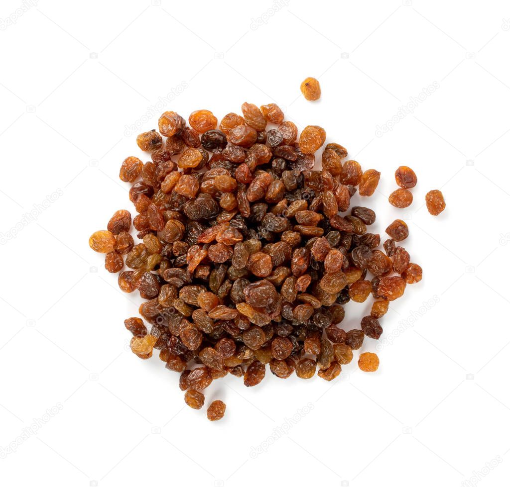 Heap of sweet raisins isolated on white background. Dried grapes pile, handful of dark brown raisin top view