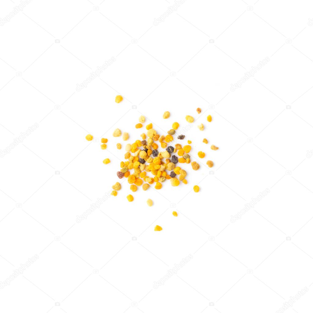 Scattered bee pollen or perga isolated on white background top view. Raw brown, yellow, orange and blue flower pollen grains or bee bread packed by worker honeybees. Healthy food supplement