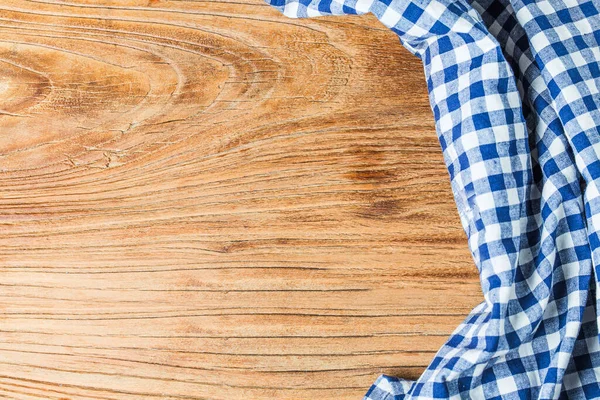 Blue table cloth on white background, copy space, top view.