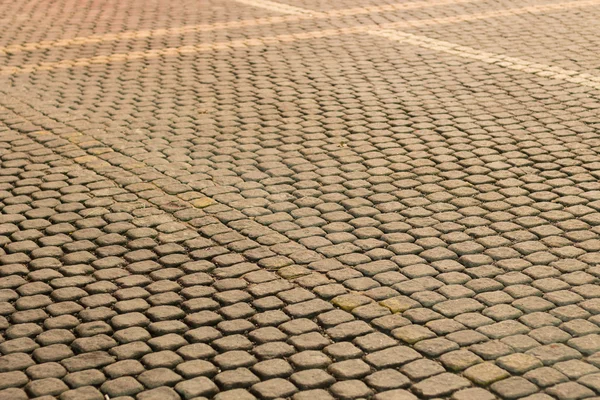 Old road paved with granite stones Stock Photo