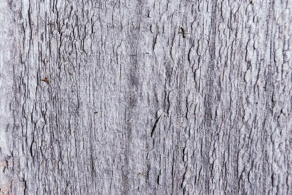 Donkerbruin gekrast houten bord — Stockfoto