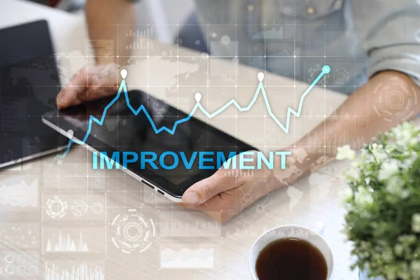 Improvement graph on virtual screen. Business and technology concept.