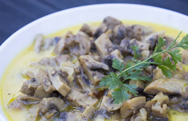 Cooked mushrooms in a white plate