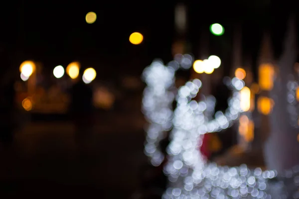 Defocused bokeh lights of christmas deer. Christmas day background. — Stock Photo, Image