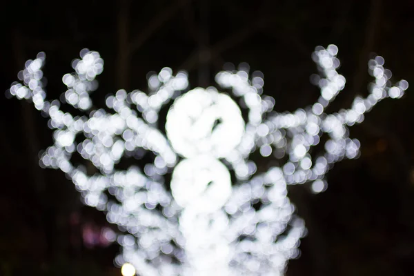 Desenfocado luces bokeh de fondo del día de Navidad . —  Fotos de Stock