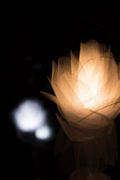 Fabric flowers with light with a bokeh background. — Stock Photo, Image