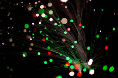 Renkli bokeh daire ışık gece kutlamak, yeşil ve kırmızı ışık arka plan bulanıklık.