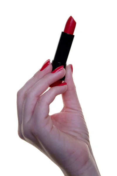 Roter Lippenstift in einer schönen weiblichen Hand. — Stockfoto