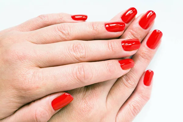 Female hands with beautiful red manicure. — Stock Photo, Image