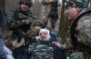 KYIV, UKRAINE MARTH 26, 2016: Ukrainian soldier takes action during reservists training near Kyiv clipart