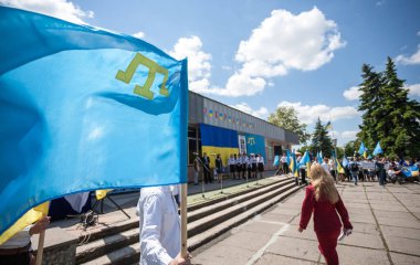 HENICHESK, UKRAINE 21 JULY, 2016: Crimean Tatar flag near the Ukraine's Crimea border clipart