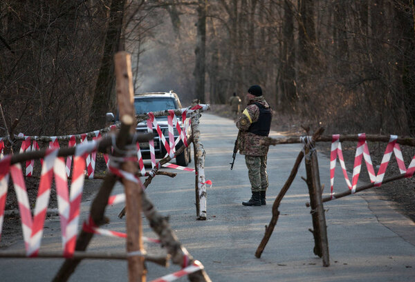 KYIV, UKRAINE MARTH 26, 2016: Ukraine soldier patrolling territory near checkpoint 