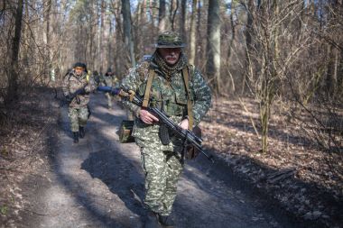 KYIV, UKRAINE MARTH 26, 2016: Ukrainian soldiers take action during reservists training near Kyiv clipart