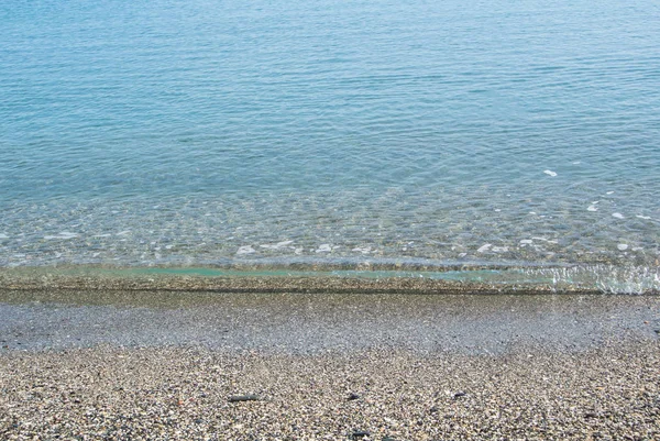 Fondo con olas transparentes en la playa de Málaga, Andalucía, España . —  Fotos de Stock
