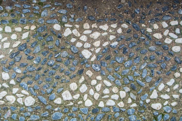 A mintát a kis köveket a gyalogút, a park Torremolinos, Andalúzia, Spanyolország. — Stock Fotó
