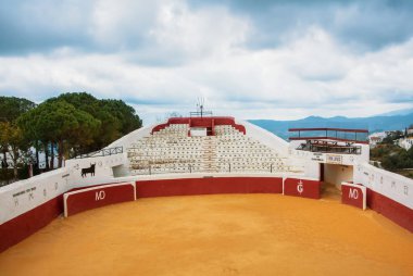 MIJAS, SPAIN - FEBRUARY 08, 2015: Old traditional bullring in Mi clipart
