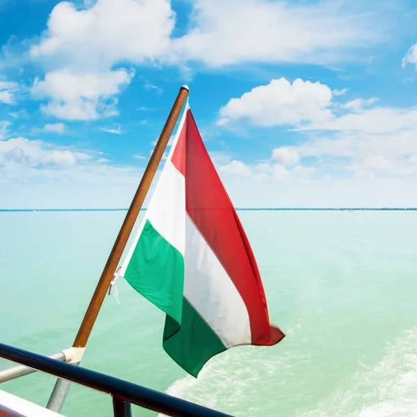 Hungarian flag flying fluttering waving in the wind at the forag — Stock Photo, Image