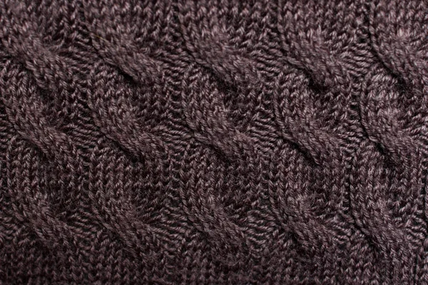 Текстура свитера из коричневой вязаной шерсти с орнаментом — стоковое фото