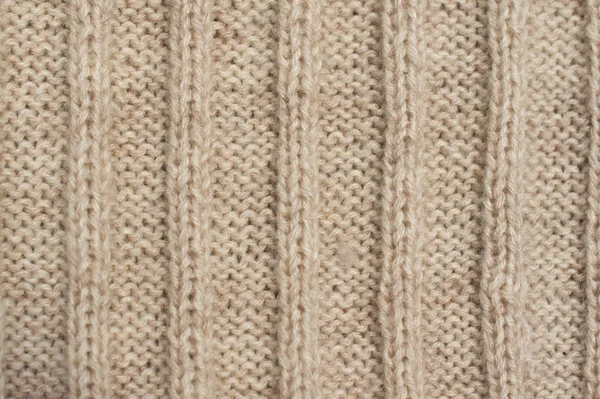 Texture of beige knitted wool sweater with ornament — Stock Photo, Image