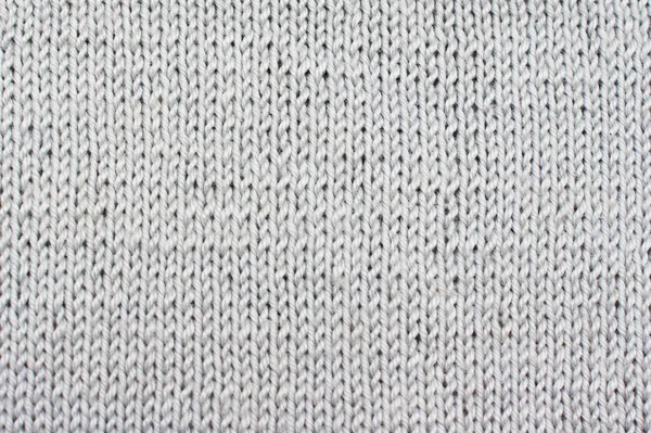 Bakgrunden grå texturerat draperier. Stickad mönster — Stockfoto