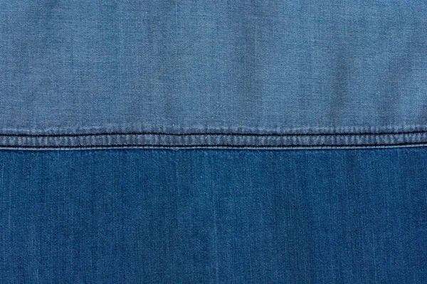 Jeans achtergrond van blauwe denim textiel — Stockfoto