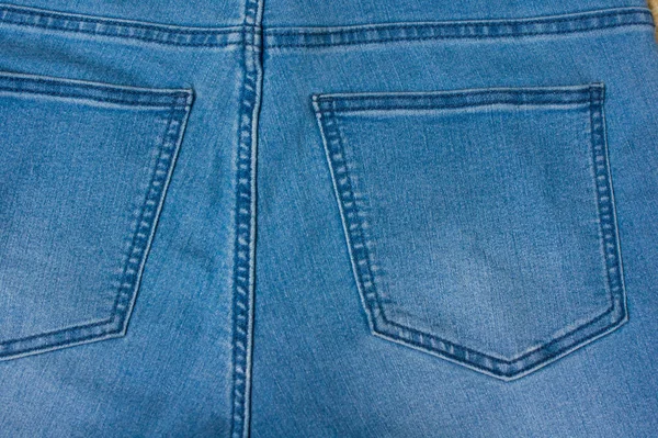 Jeans achtergrond van blauwe denim textiel — Stockfoto