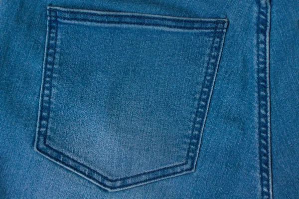 Jeans bakgrund av blå denim textil — Stockfoto
