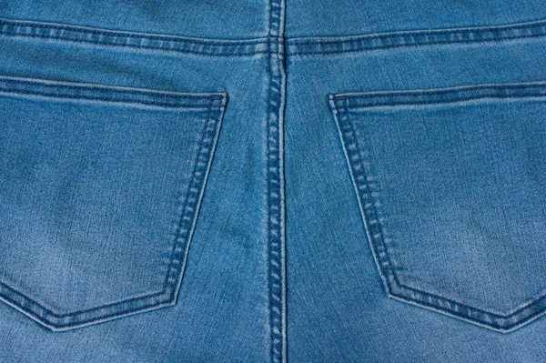 Jeans fundo de tecido de ganga azul — Fotografia de Stock