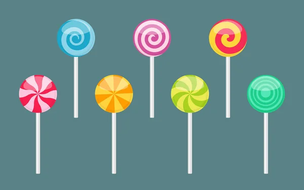 Set of lollipops with spiral and ray patterns — Stock Vector