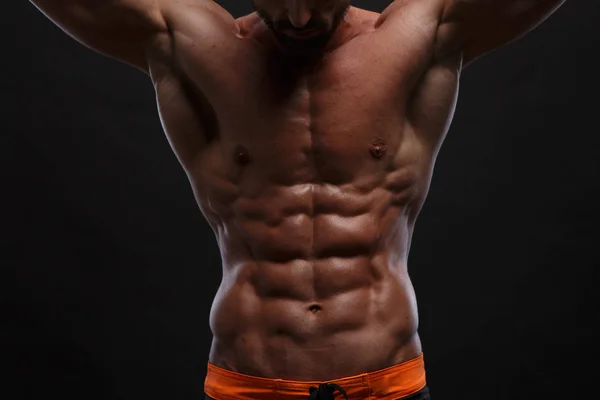 Cropped image of athletic man showing perfect sixpack abs — Stock Photo, Image