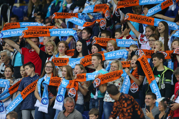 KHARKIV, UKRAINE - 13 SEPTEMBER, 2017: Shakhtar Donetsk happy fans with scarfs on the stands. Champions League. Shakhtar - Napoli. Metalist stadium
