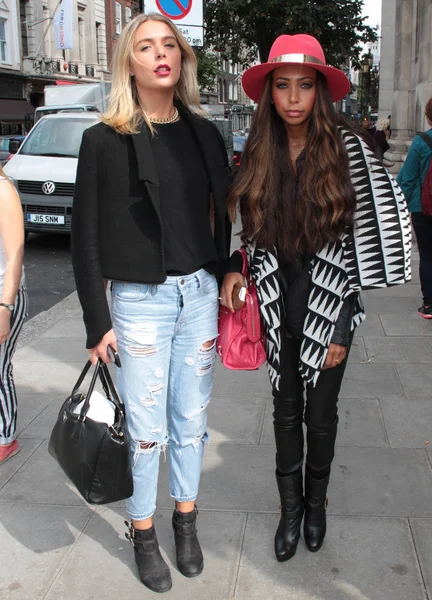 LONDON - SEP 12, 2014: Guest showing street style on day one at London Fashion Week SS15 in London