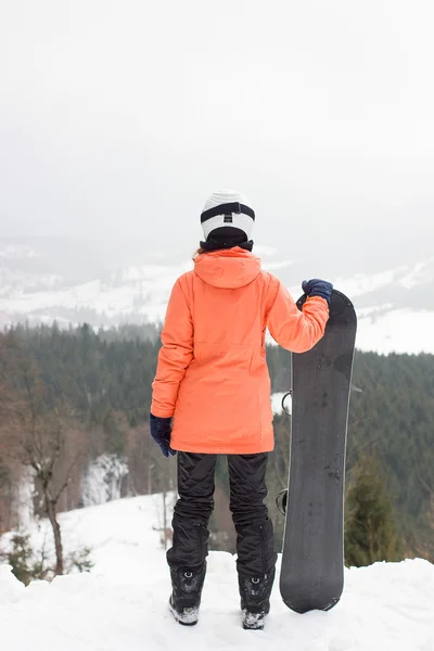 Menina com um snowboard — Fotografia de Stock