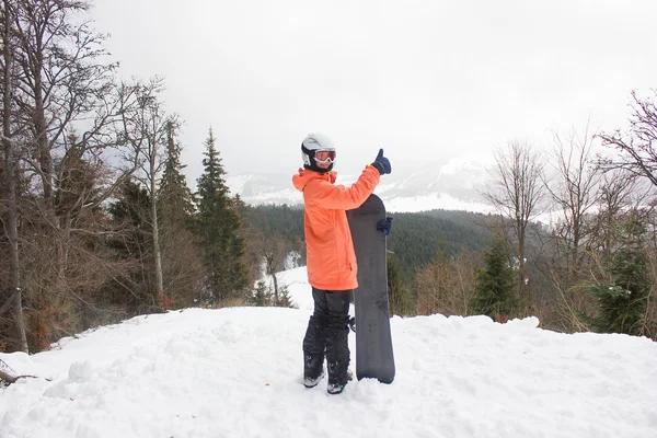 Girl with a snowboard — Stock Photo, Image