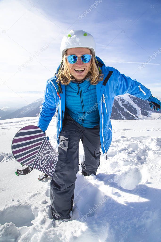 Professional snowboarder in Alps. Italy Val di fassa