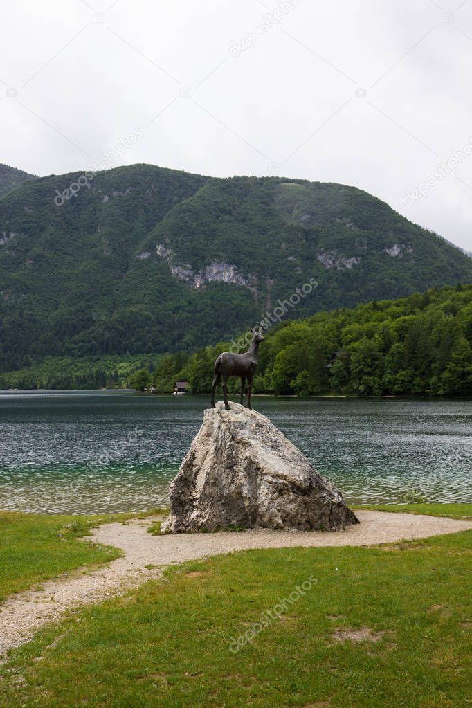 Goldenhorn statue on Bohinj lake, Slovenia
