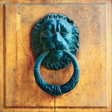 Architectural details -ancient door knoker with lion clipart