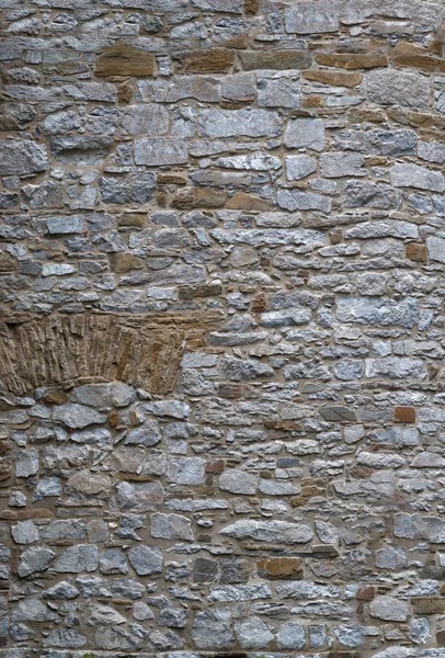 masonry walls made of old stones background for designer