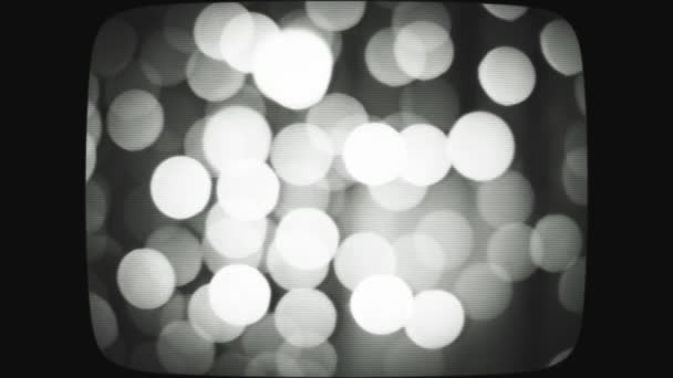 Stylize the video under the old kinescope screen. Blurred Christmas lights. bokeh background. Stock video — Stock Video