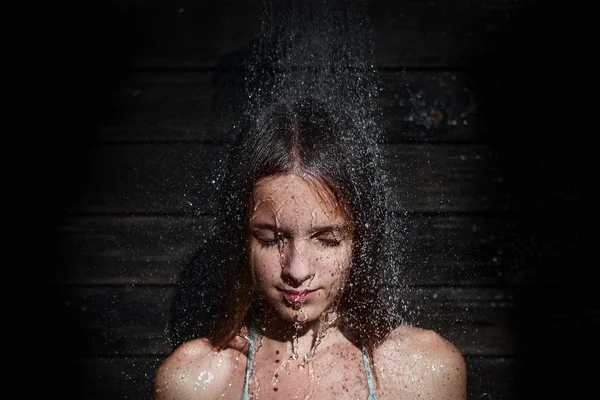 Girl under outdoor shower — Stock Photo, Image