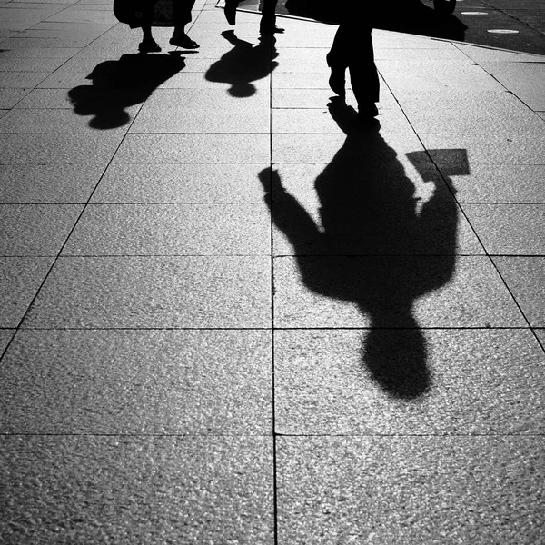 Shadows and Silhouettes of people on street — Stock Photo, Image