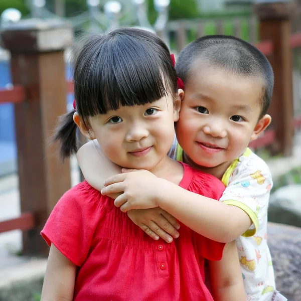 Portrait Little Asian Kids Hugging Looking Camera — Stock Photo, Image