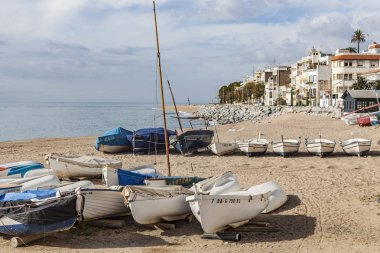 SANT POL DE MAR,SPAIN-OCTOBER 8,2015: Beach and mediterranean sea in catalan village of Sant Pol de Mar, province Barcelona, comarca Maresme, Catalonia,Spain. clipart