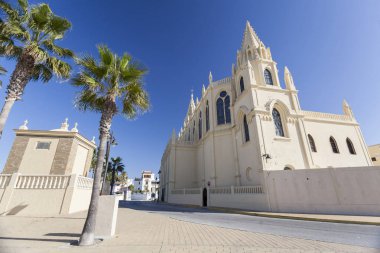Sanctuary of Nuestra Senora de la Regla, maritime promenade of Chipiona, Andalucia. clipart