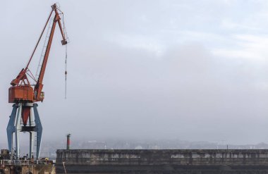 Port view of Santurtzi, pier and big crane ,Basque Country. clipart