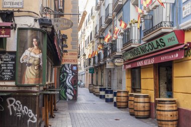 Typical street in El tubo,famous area in the city, tapas food, Zaragoza. clipart